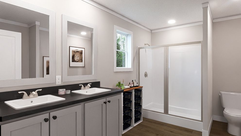 The ROCKET MAN Primary Bathroom. This Manufactured Mobile Home features 3 bedrooms and 2 baths.