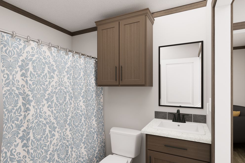 The THE TRUMAN Guest Bathroom. This Manufactured Mobile Home features 3 bedrooms and 2 baths.