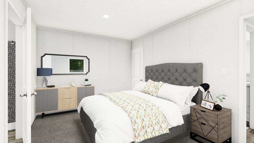 The PERIDOT 56 Primary Bedroom. This Manufactured Mobile Home features 2 bedrooms and 2 baths.