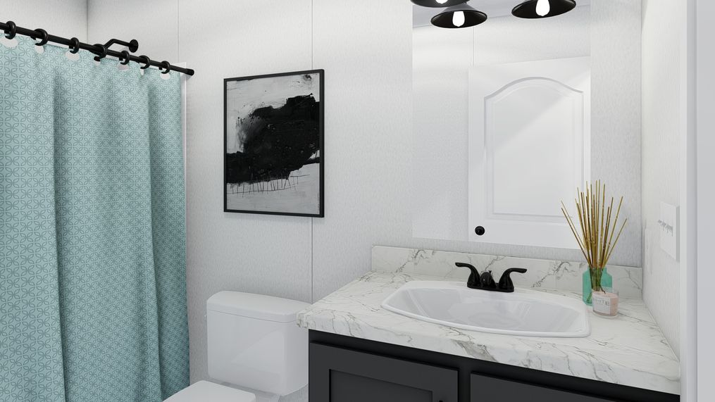 The THE FUSION C Guest Bathroom. This Manufactured Mobile Home features 3 bedrooms and 2 baths.