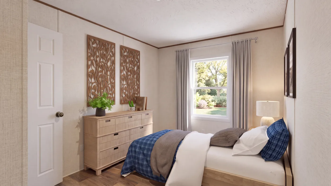 The CEDAR Guest Bedroom. This Manufactured Mobile Home features 3 bedrooms and 2 baths.