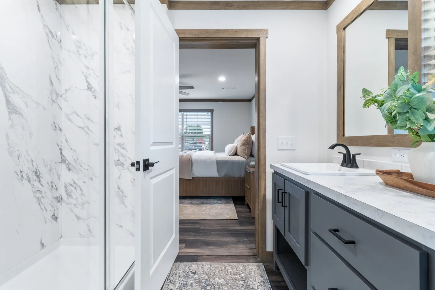 The EVERETT ELITE Primary Bathroom. This Manufactured Mobile Home features 4 bedrooms and 3 baths.