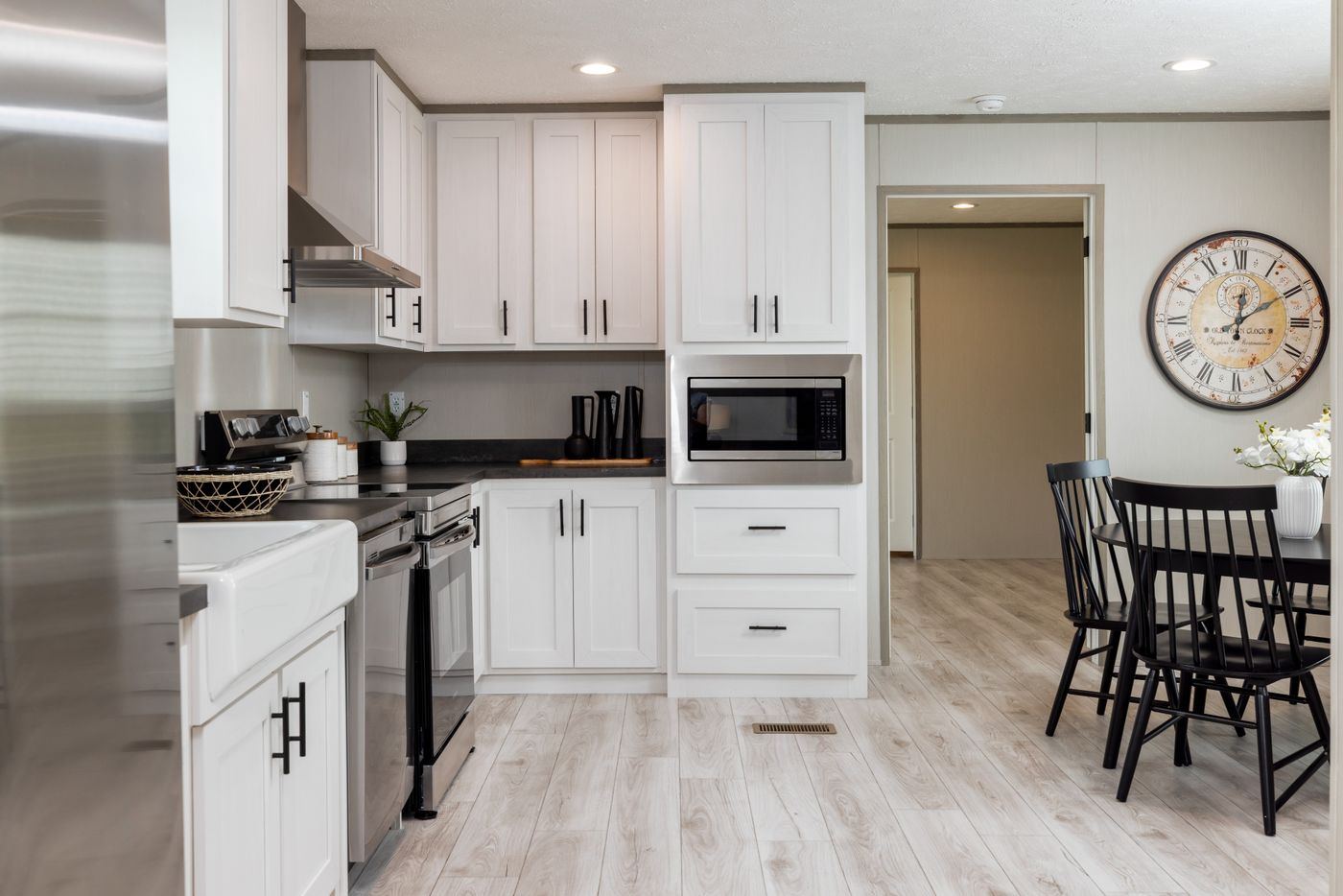 The SHOWER HOUSE Kitchen. This Manufactured Mobile Home features 3 bedrooms and 2 baths.