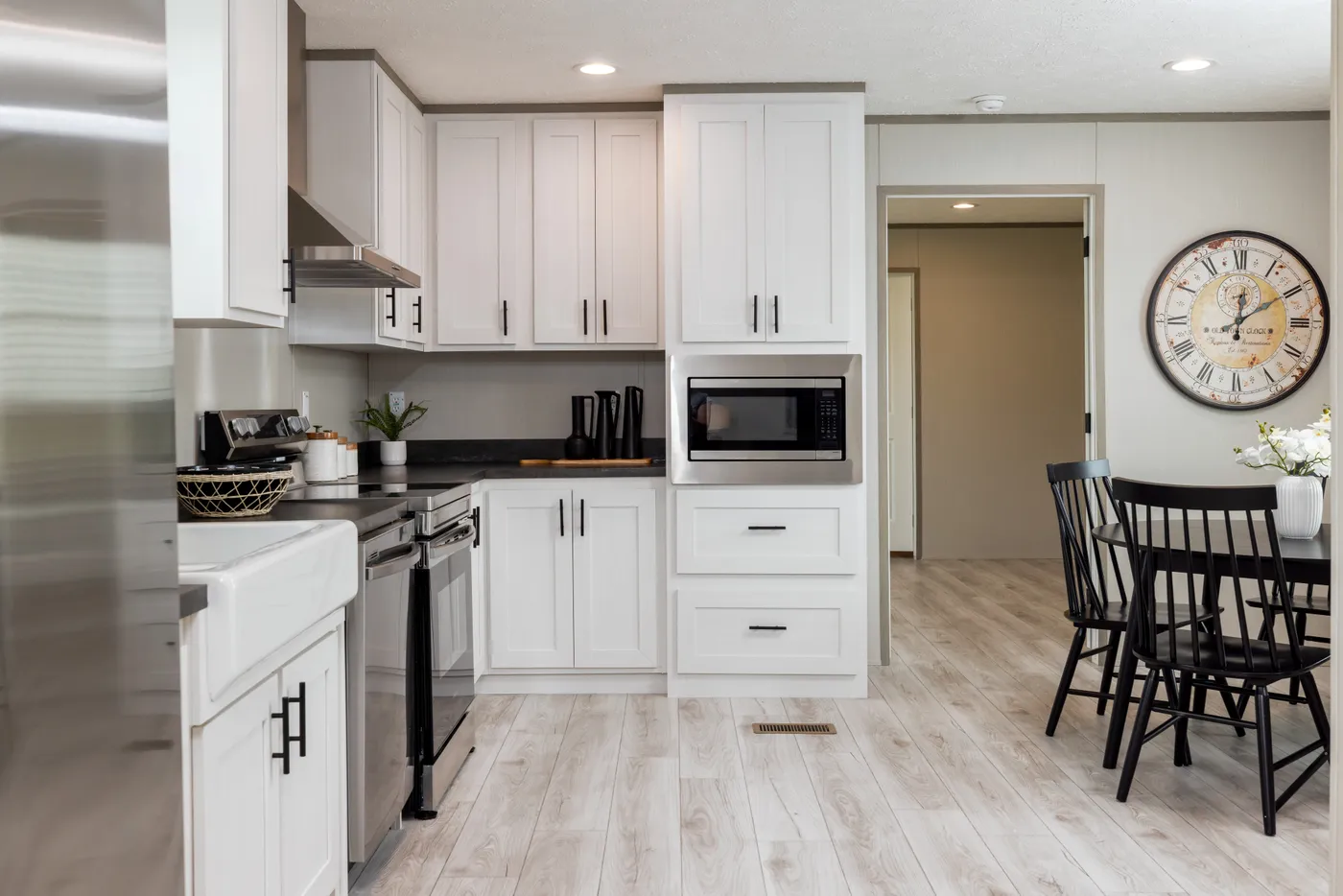 The SHOWER HOUSE Kitchen. This Manufactured Mobile Home features 3 bedrooms and 2 baths.