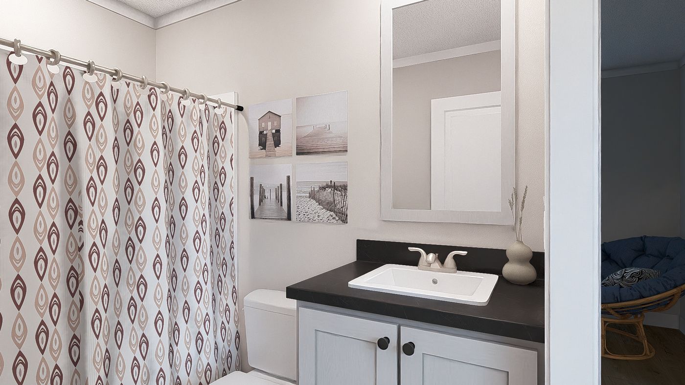 The SWEET CAROLINE Guest Bathroom. This Manufactured Mobile Home features 3 bedrooms and 2 baths.