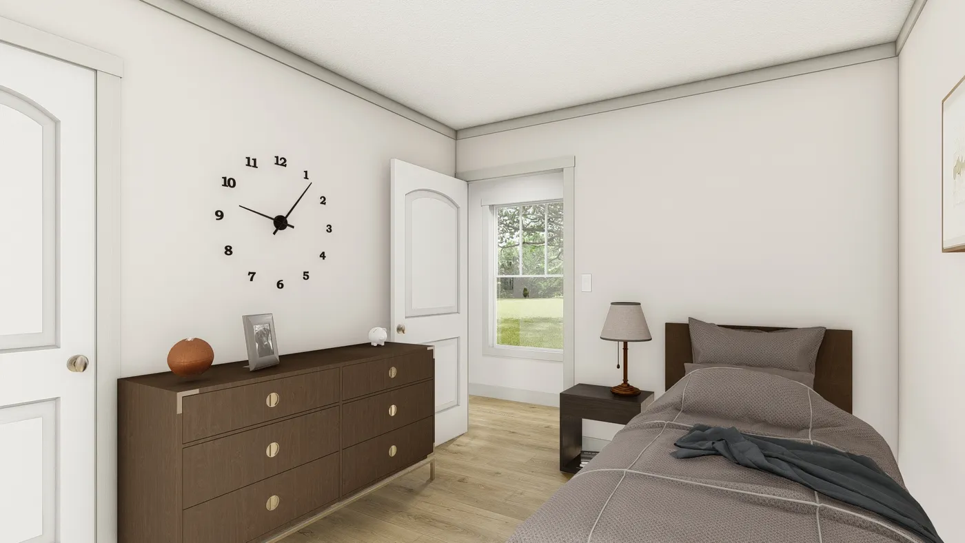 The 1676 SWEET CAROLINE Guest Bedroom. This Manufactured Mobile Home features 3 bedrooms and 2 baths.