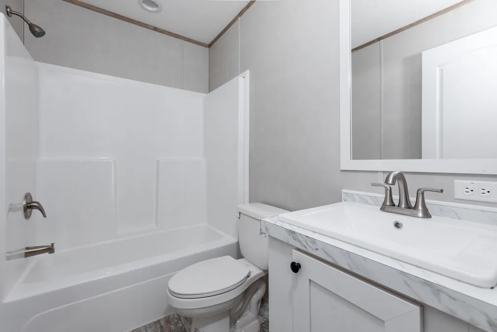 The TRUMAN Guest Bathroom. This Manufactured Mobile Home features 4 bedrooms and 2 baths.
