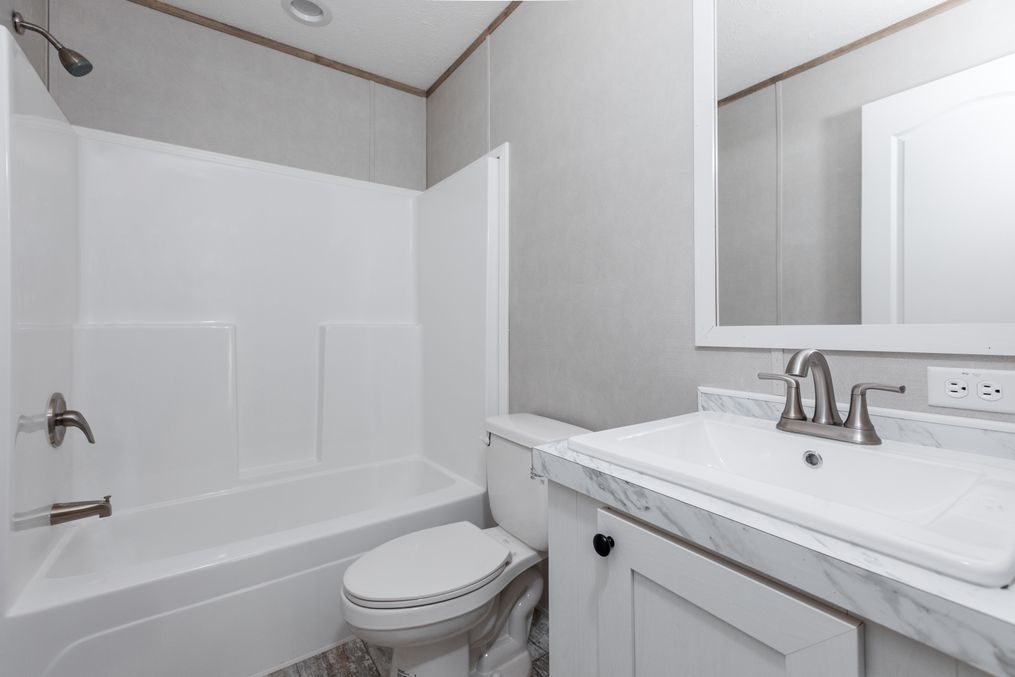 The TRUMAN Guest Bathroom. This Manufactured Mobile Home features 4 bedrooms and 2 baths.