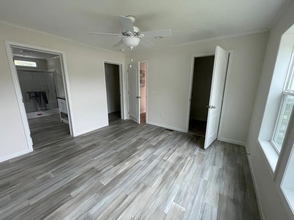 The MOONSTONE Primary Bedroom. This Manufactured Mobile Home features 3 bedrooms and 2 baths.