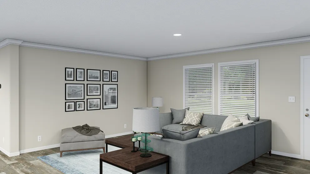 The CAROLINIAN M5010 Living Room. This Manufactured Mobile Home features 3 bedrooms and 2 baths.
