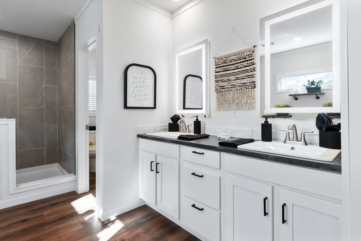 The THE SEDONA 4 Primary Bathroom. This Manufactured Mobile Home features 4 bedrooms and 2 baths.