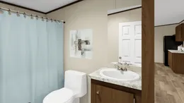 The SATISFACTION Guest Bathroom. This Manufactured Mobile Home features 3 bedrooms and 2 baths.