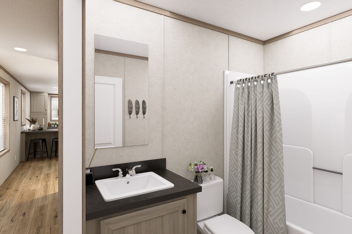 The 6616-CC03 HARBORVIEW 66 Guest Bathroom. This Manufactured Mobile Home features 3 bedrooms and 2 baths.