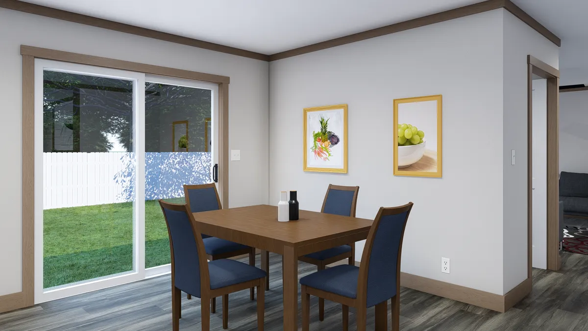 The LORALEI Dining Room. This Manufactured Mobile Home features 3 bedrooms and 2 baths.