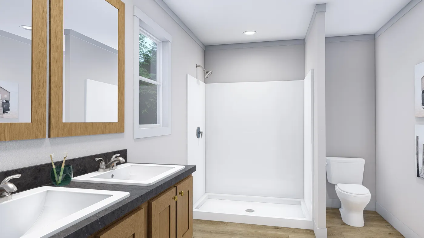 The LOVELY DAY Primary Bathroom. This Manufactured Mobile Home features 4 bedrooms and 2 baths.
