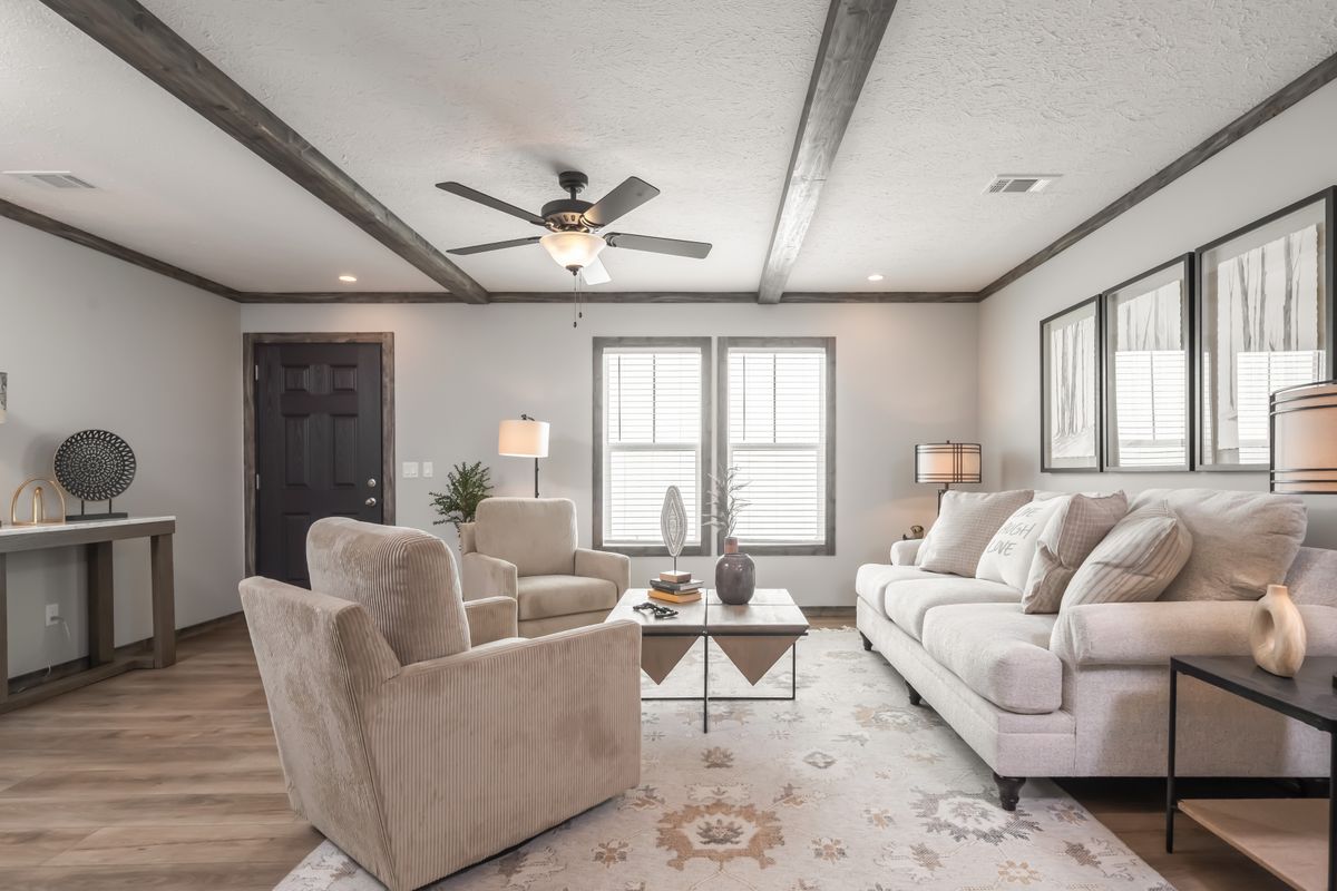 The THE JACKSON Living Room. This Manufactured Mobile Home features 4 bedrooms and 2 baths.