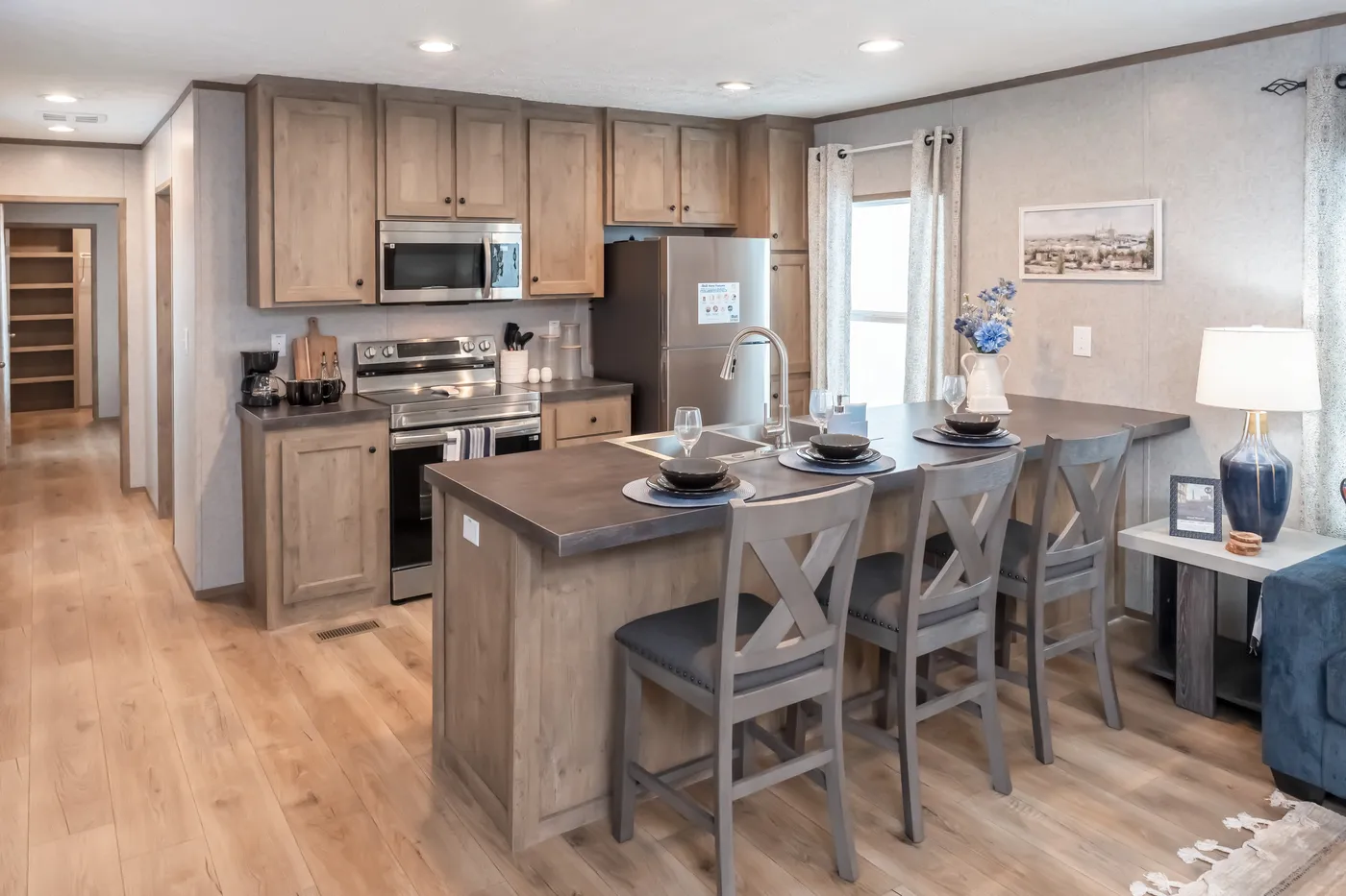 The WARRIOR II Kitchen. This Manufactured Mobile Home features 2 bedrooms and 2 baths.