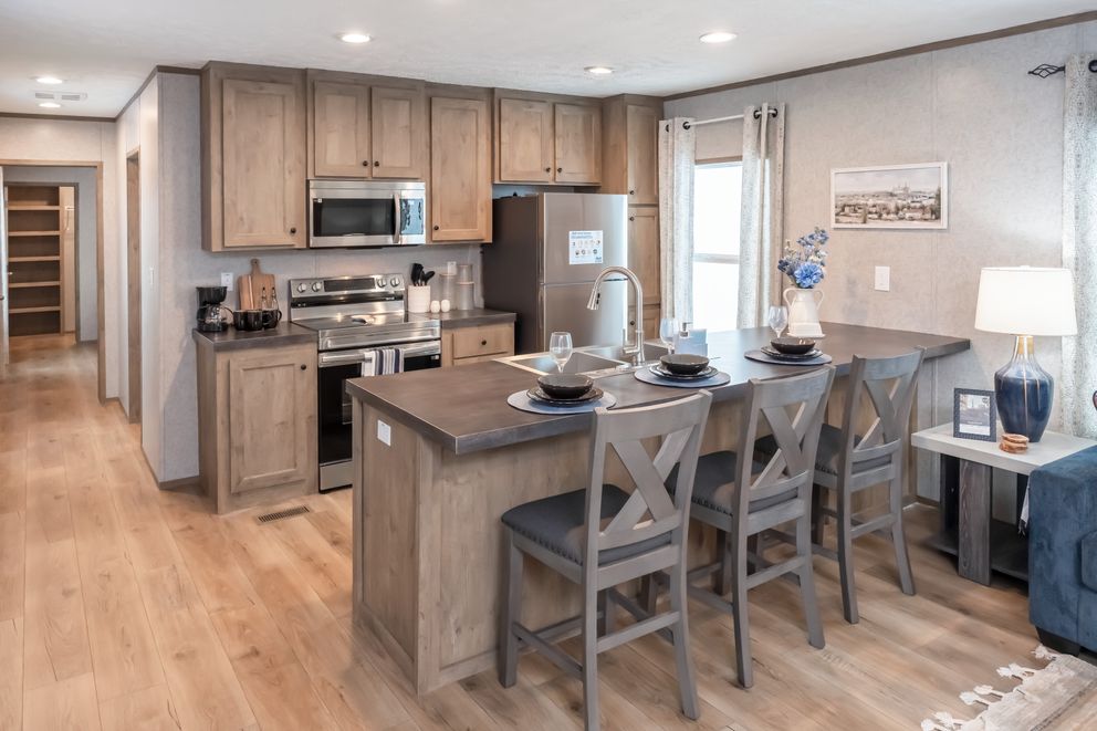 The WARRIOR II Kitchen. This Manufactured Mobile Home features 2 bedrooms and 2 baths.