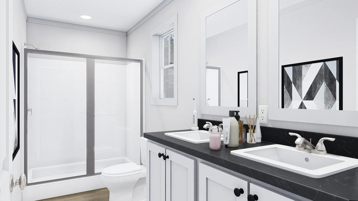 The JOHNNY B GOODE Primary Bathroom. This Manufactured Mobile Home features 3 bedrooms and 2 baths.