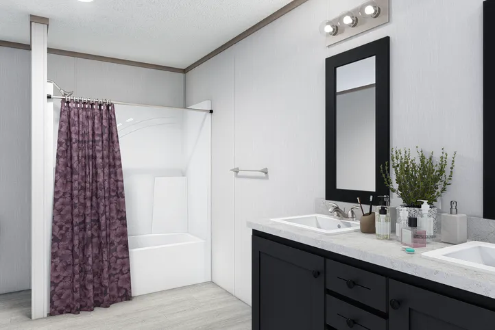 The 5228-E774P THE PULSE Primary Bathroom. This Manufactured Mobile Home features 3 bedrooms and 2 baths.