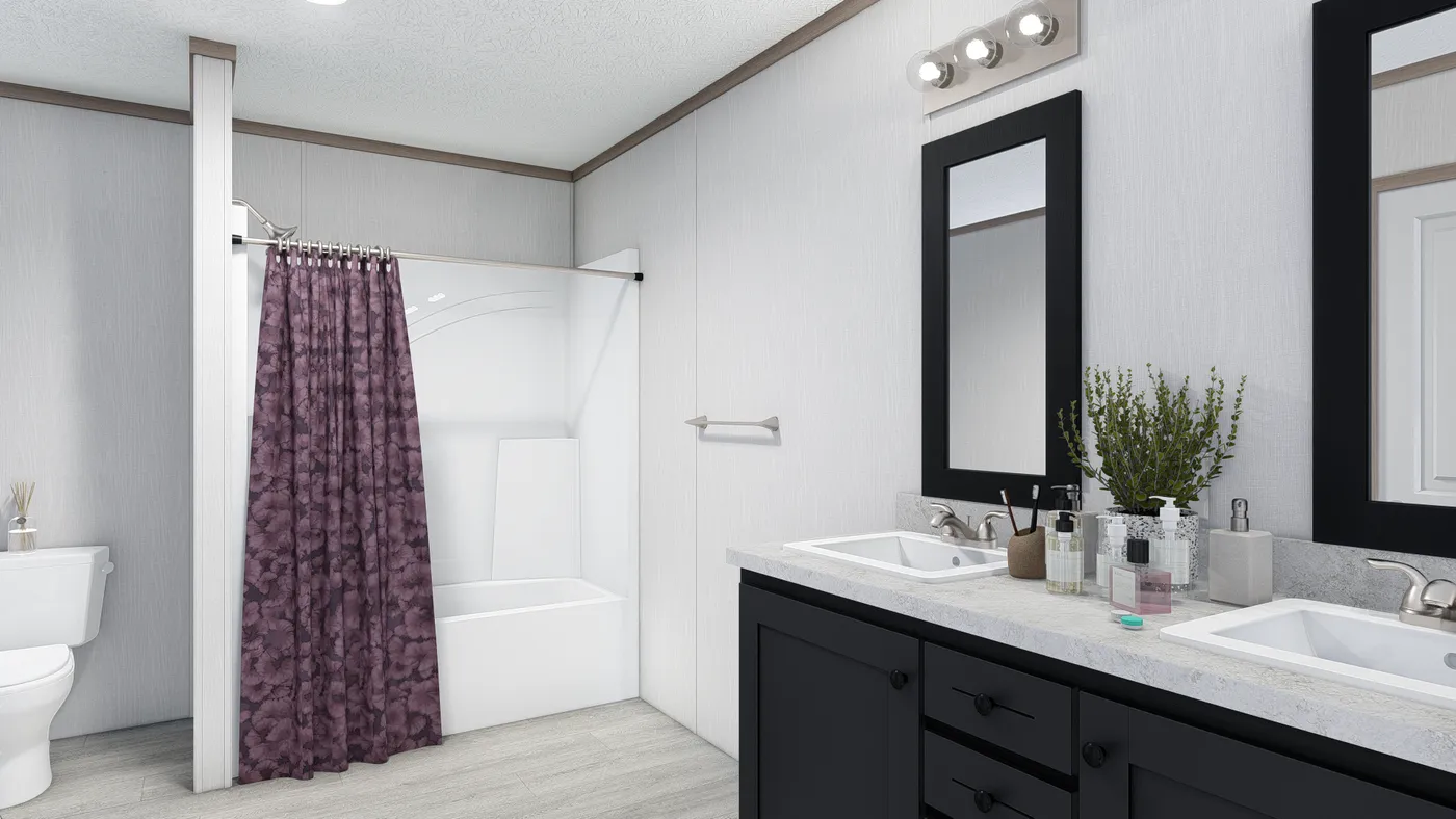 The 5228-E774P THE PULSE Primary Bathroom. This Manufactured Mobile Home features 3 bedrooms and 2 baths.