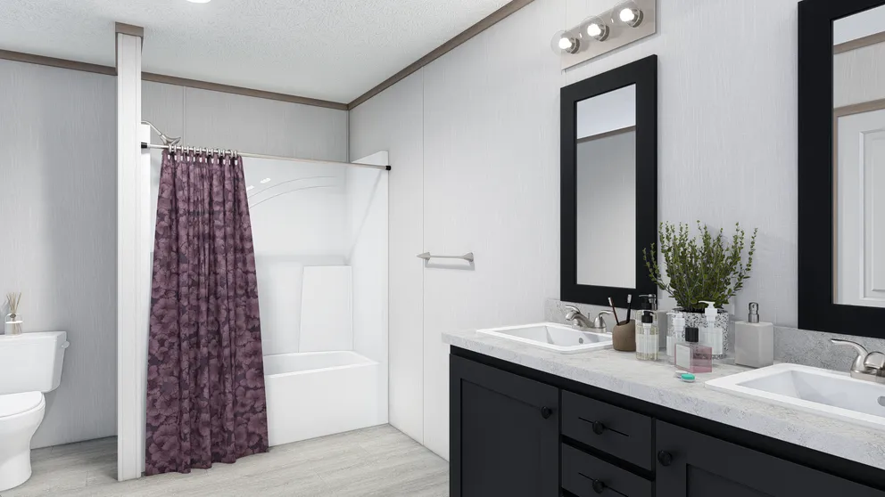The 5228-E774P THE PULSE Primary Bathroom. This Manufactured Mobile Home features 3 bedrooms and 2 baths.
