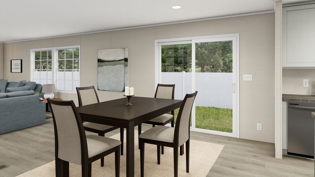 The LEGEND BIG BOY Dining Area. This Manufactured Mobile Home features 4 bedrooms and 2 baths.