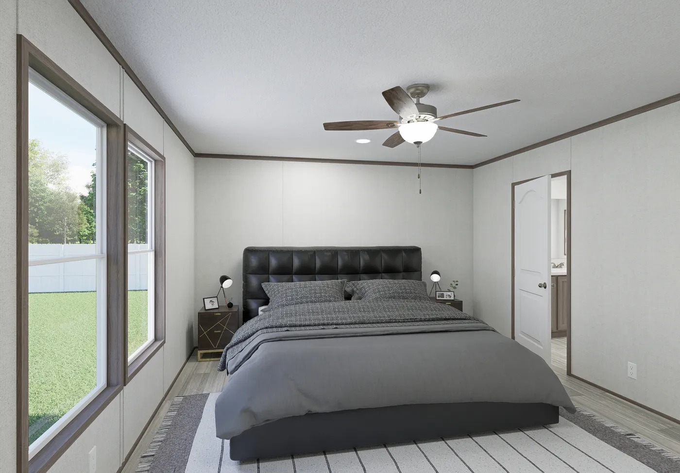 The THE MOUNTAINEER 64 Primary Bedroom. This Manufactured Mobile Home features 3 bedrooms and 2 baths.