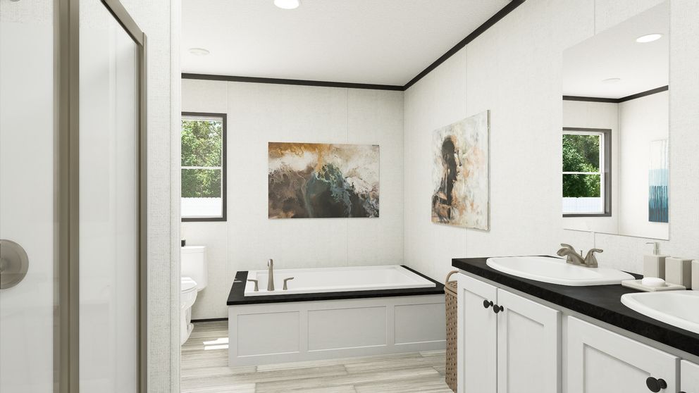 The THE MOUNTAINEER 56 Primary Bathroom. This Manufactured Mobile Home features 3 bedrooms and 2 baths.