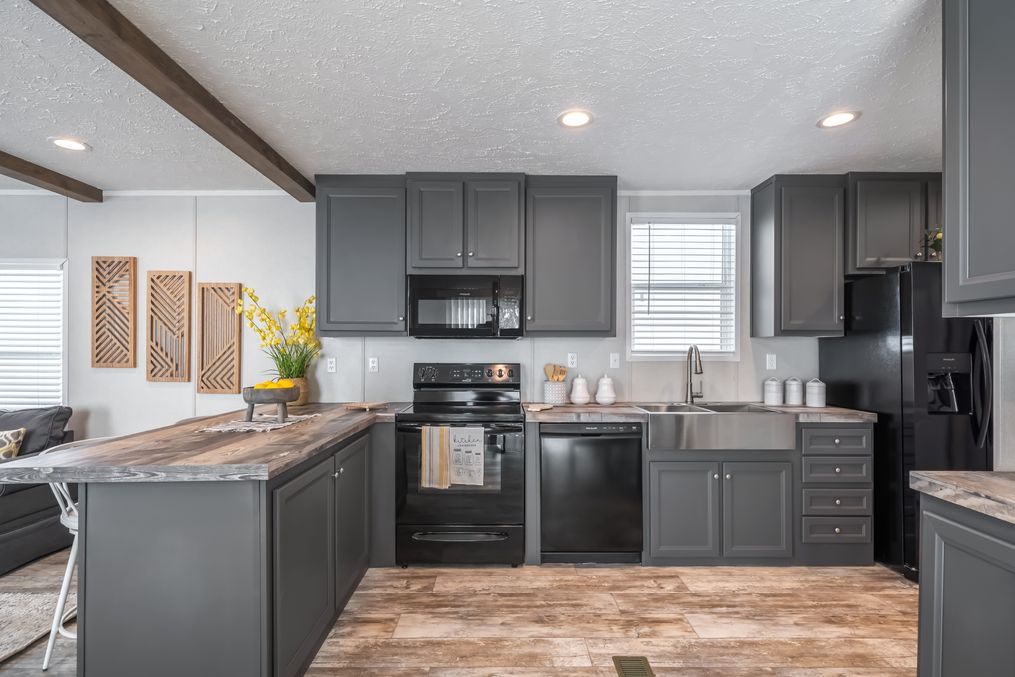 The ANNIVERSARY CHOICE Kitchen. This Manufactured Mobile Home features 3 bedrooms and 2 baths.