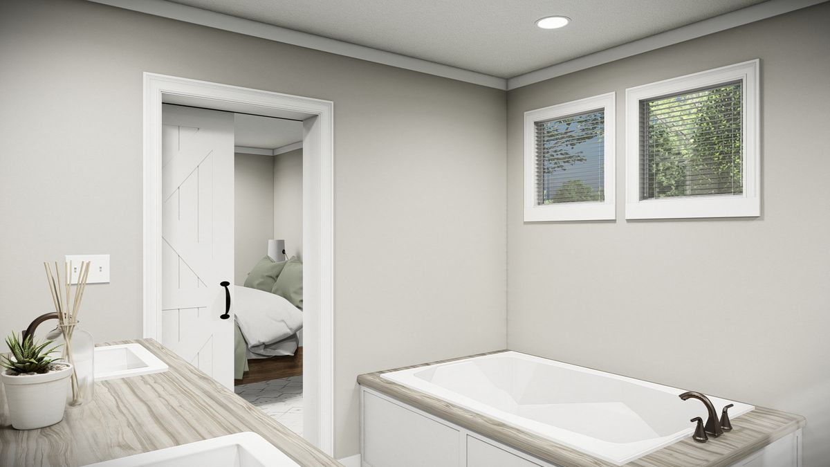 The THE WASHINGTON Primary Bathroom. This Manufactured Mobile Home features 3 bedrooms and 2 baths.