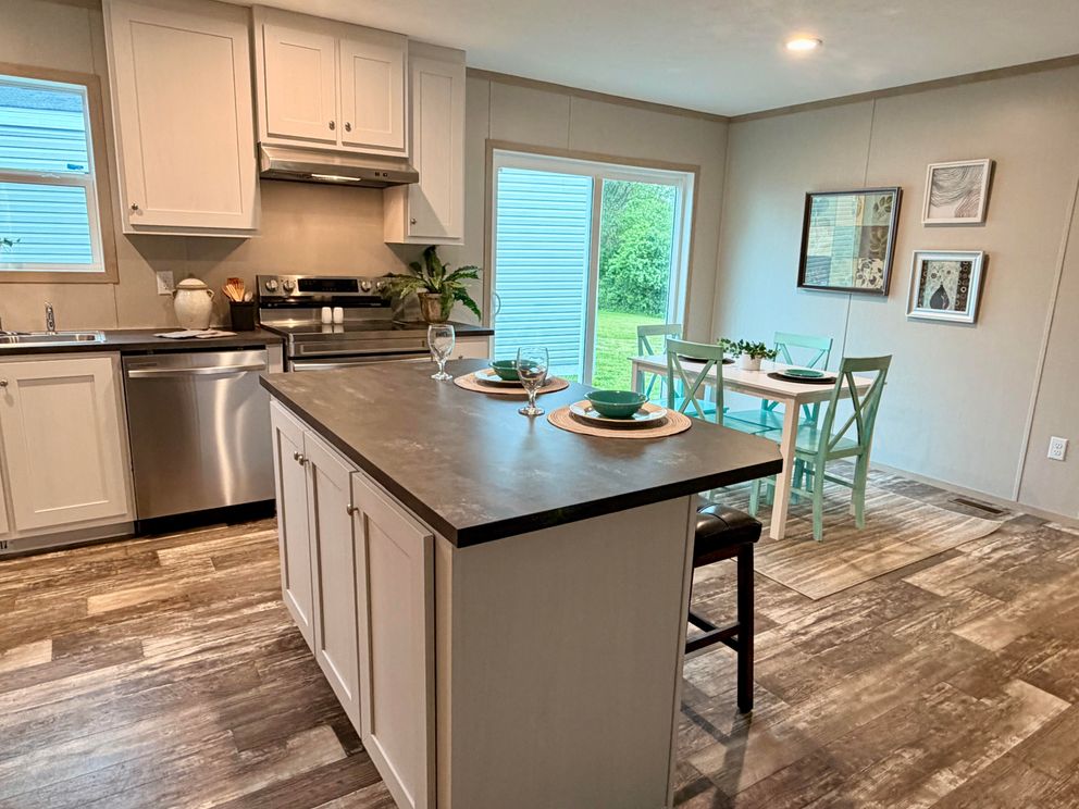 The FRANKLIN Dining Area. This Manufactured Mobile Home features 3 bedrooms and 2 baths.