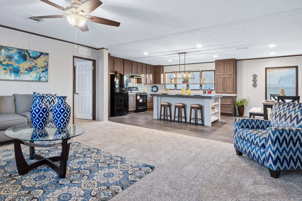 The HERCULES Living Room. This Manufactured Mobile Home features 4 bedrooms and 2 baths.