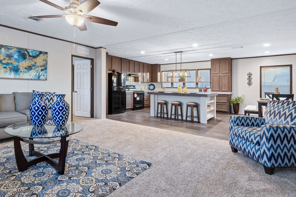 The HERCULES Living Room. This Manufactured Mobile Home features 4 bedrooms and 2 baths.
