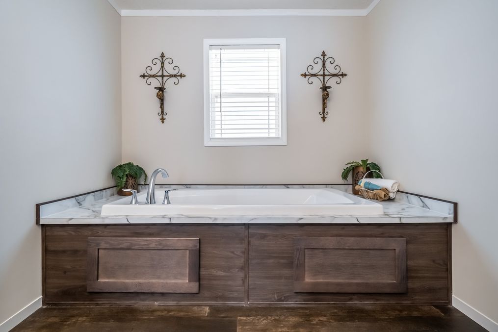 The MAVERICK 56A Primary Bathroom. This Manufactured Mobile Home features 3 bedrooms and 2 baths.
