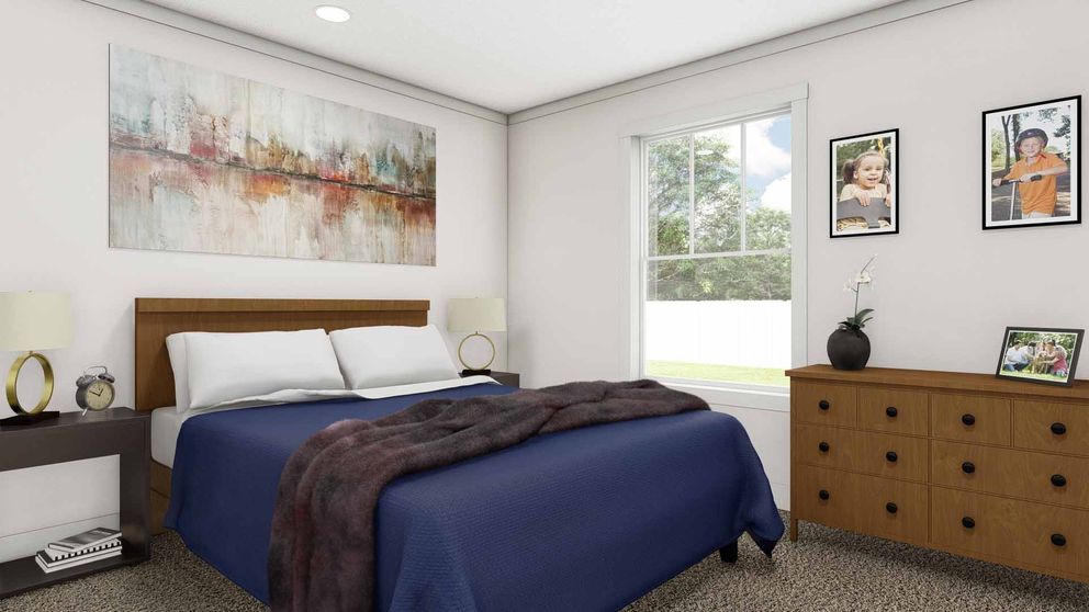 The STAND BY ME Primary Bedroom. This Manufactured Mobile Home features 3 bedrooms and 2 baths.