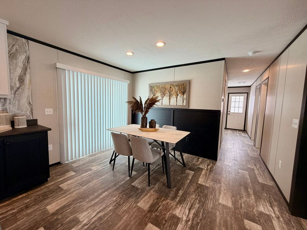 The DIAMOND Dining Area. This Manufactured Mobile Home features 3 bedrooms and 2 baths.