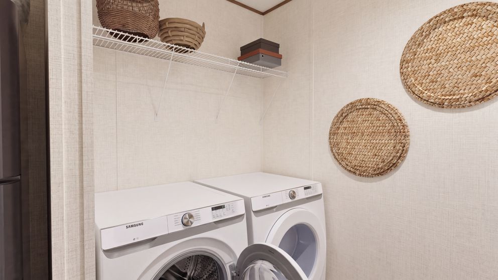 The HICKORY Utility Room. This Manufactured Mobile Home features 3 bedrooms and 2 baths.