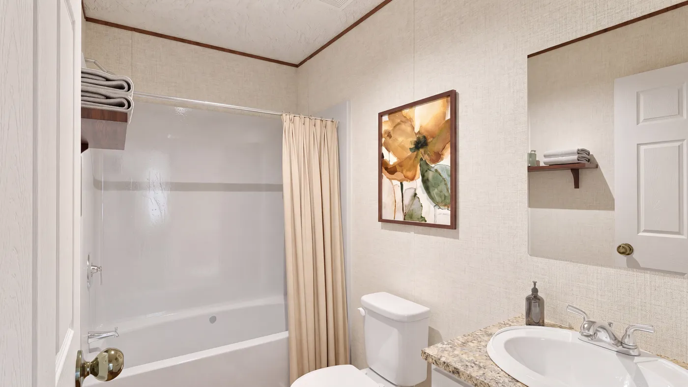 The REDWOOD Guest Bathroom. This Manufactured Mobile Home features 5 bedrooms and 3 baths.