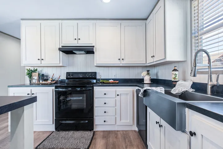 The PORCH LIVING SERIES 16682A Kitchen. This Manufactured Mobile Home features 2 bedrooms and 2 baths.