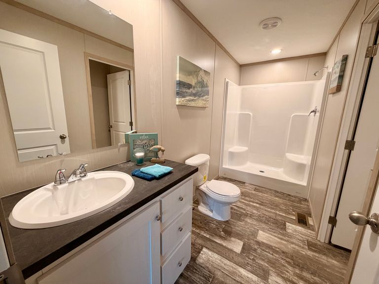 The HANCOCK Primary Bathroom. This Manufactured Mobile Home features 4 bedrooms and 2 baths.