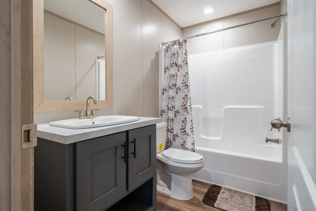 The BOONE Guest Bathroom. This Manufactured Mobile Home features 4 bedrooms and 2 baths.