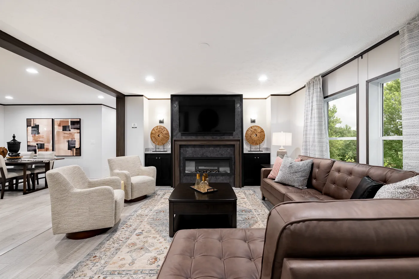 The CRESTWOOD Living Room. This Manufactured Mobile Home features 3 bedrooms and 2 baths.