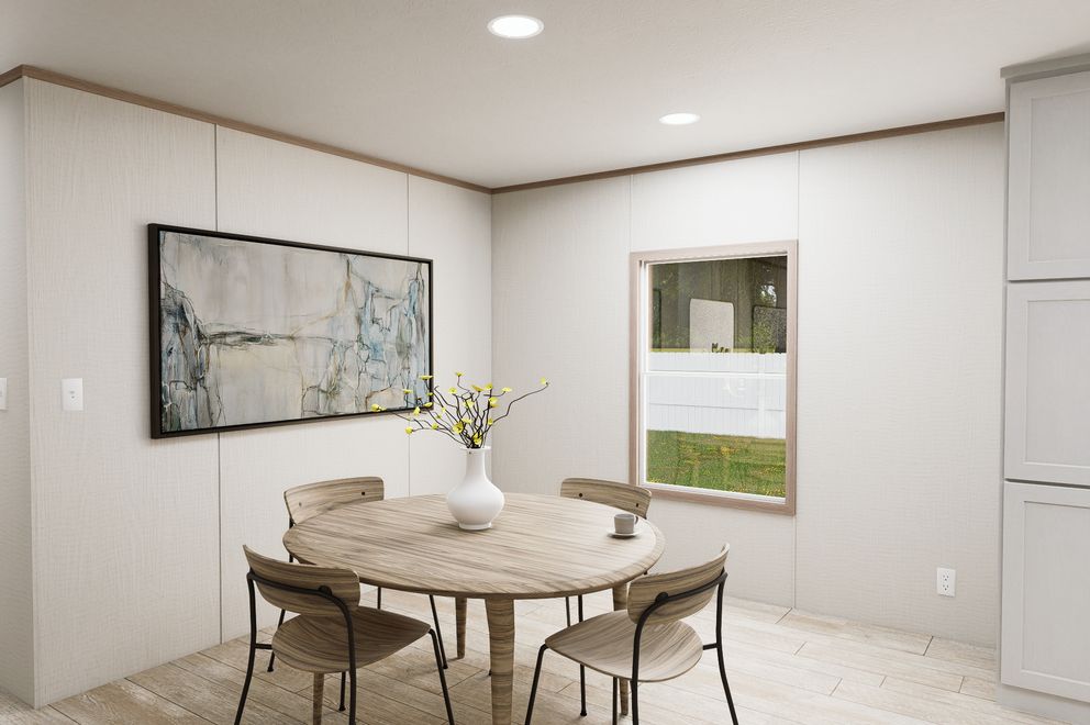 The ULTRA FLEX 76 Dining Area. This Manufactured Mobile Home features 4 bedrooms and 2 baths.