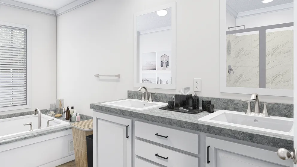 The BIG EASY M001 Primary Bathroom. This Manufactured Mobile Home features 4 bedrooms and 2 baths.