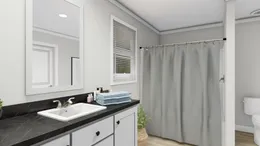 The TUCSON Primary Bathroom. This Manufactured Mobile Home features 3 bedrooms and 2 baths.