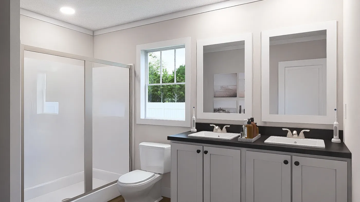 The WHOLE LOTTA LOVE Primary Bathroom. This Manufactured Mobile Home features 3 bedrooms and 2 baths.