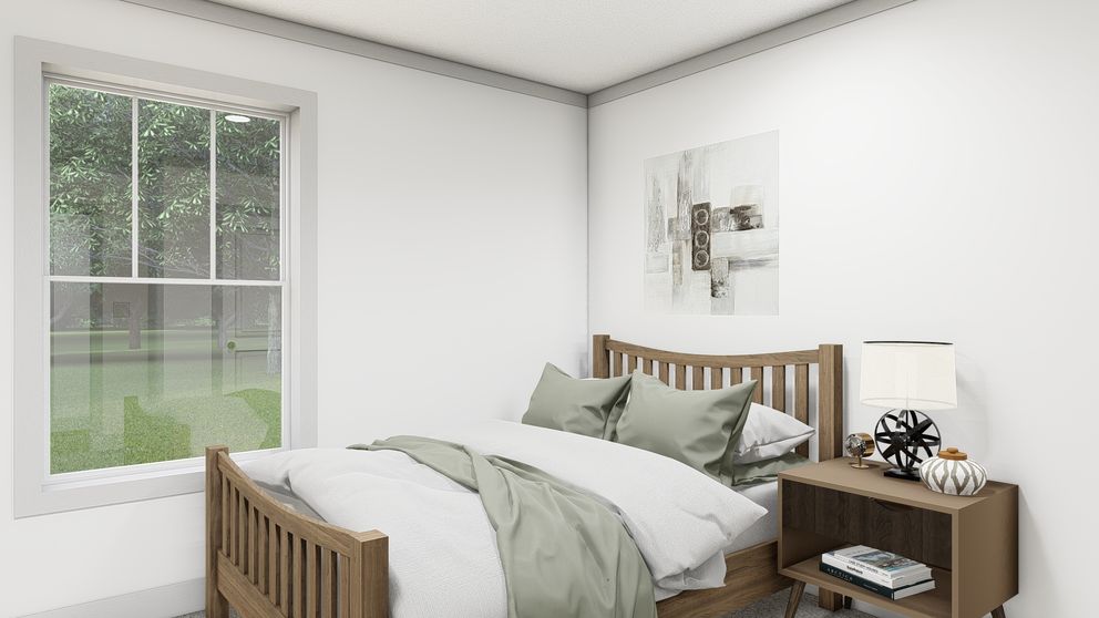 The WONDERFUL WORLD Guest Bedroom. This Manufactured Mobile Home features 3 bedrooms and 2 baths.