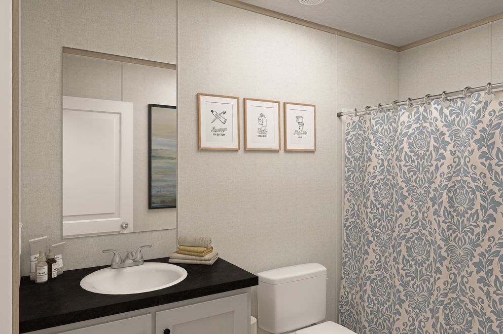 The THE EAGLE 76 Guest Bathroom. This Manufactured Mobile Home features 5 bedrooms and 2 baths.
