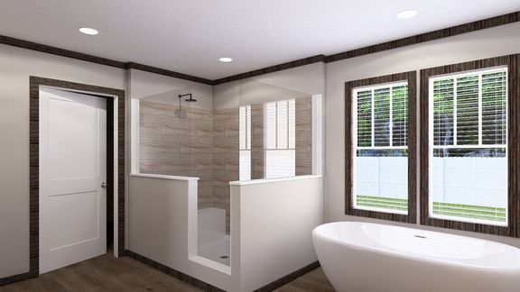 The THE JACKSON Primary Bathroom. This Manufactured Mobile Home features 4 bedrooms and 2 baths.